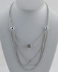 Layered faux pearl chain necklace w/ rhinestone detail