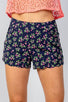 Ladies fashion navy floral print scalloped hem shorts